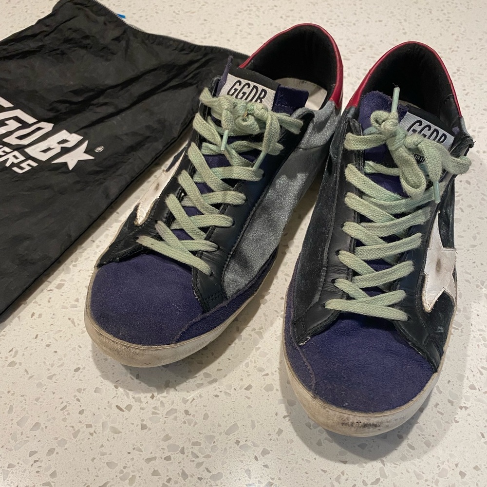 Barely worn Golden Goose size 8/41 men’s all-star sneakers. Comes with og pouch.